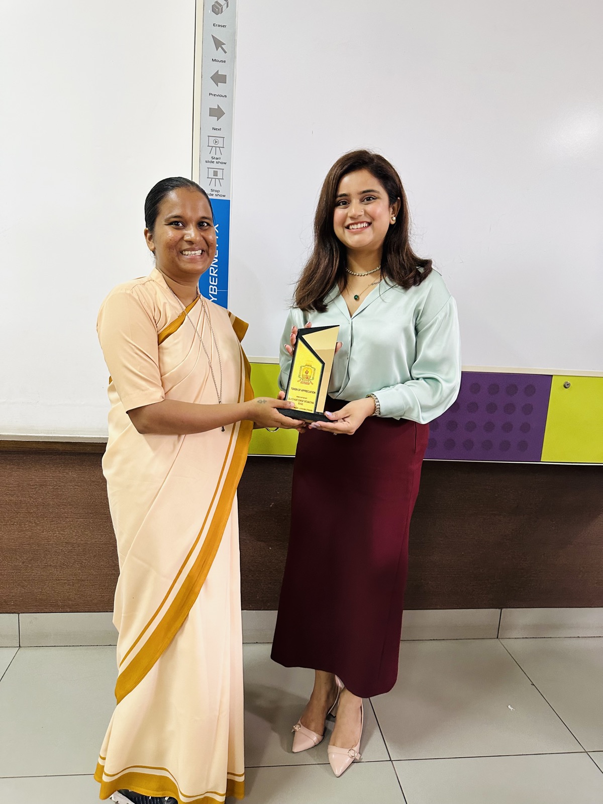 Coach Shavy Jain receiving a token of appreciation