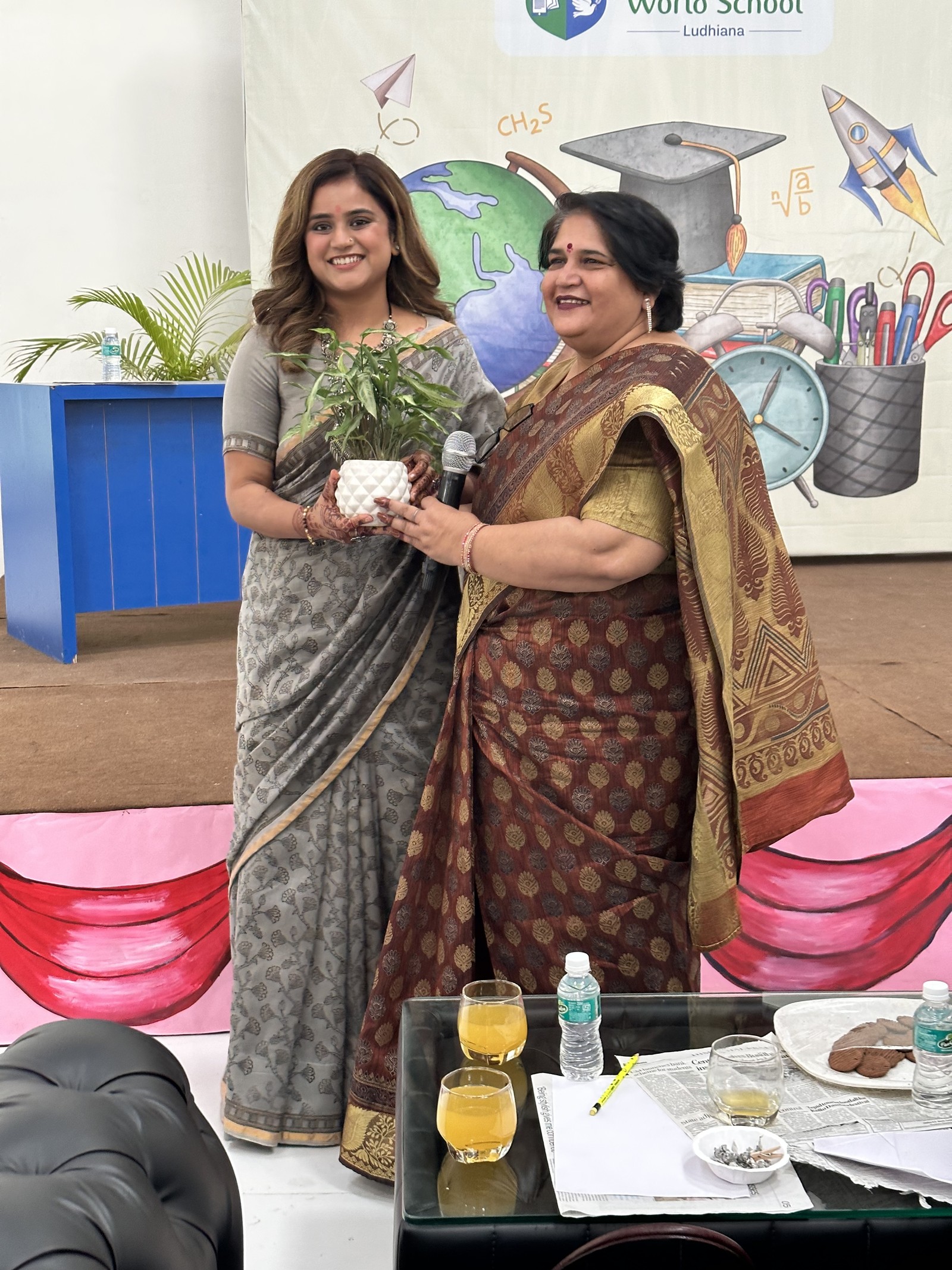 Coach Shavy Jain receiving appreciation at a World School event