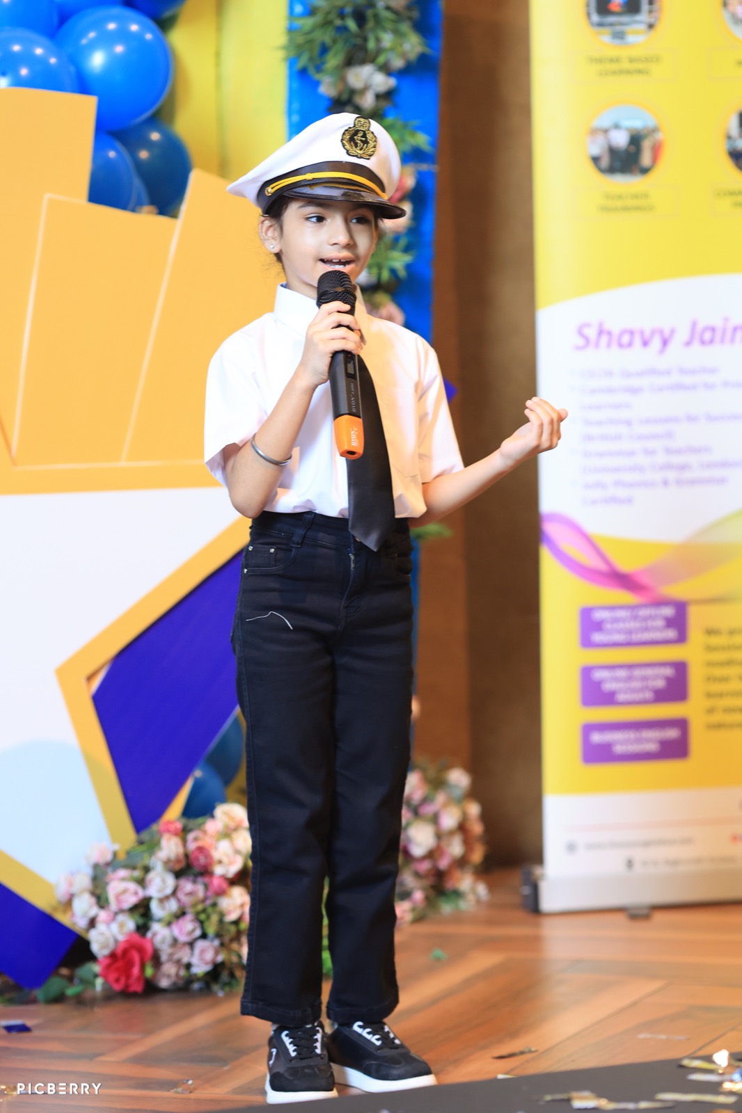 Student in a sailor cap presenting her pitch at Entrepreneurship Day