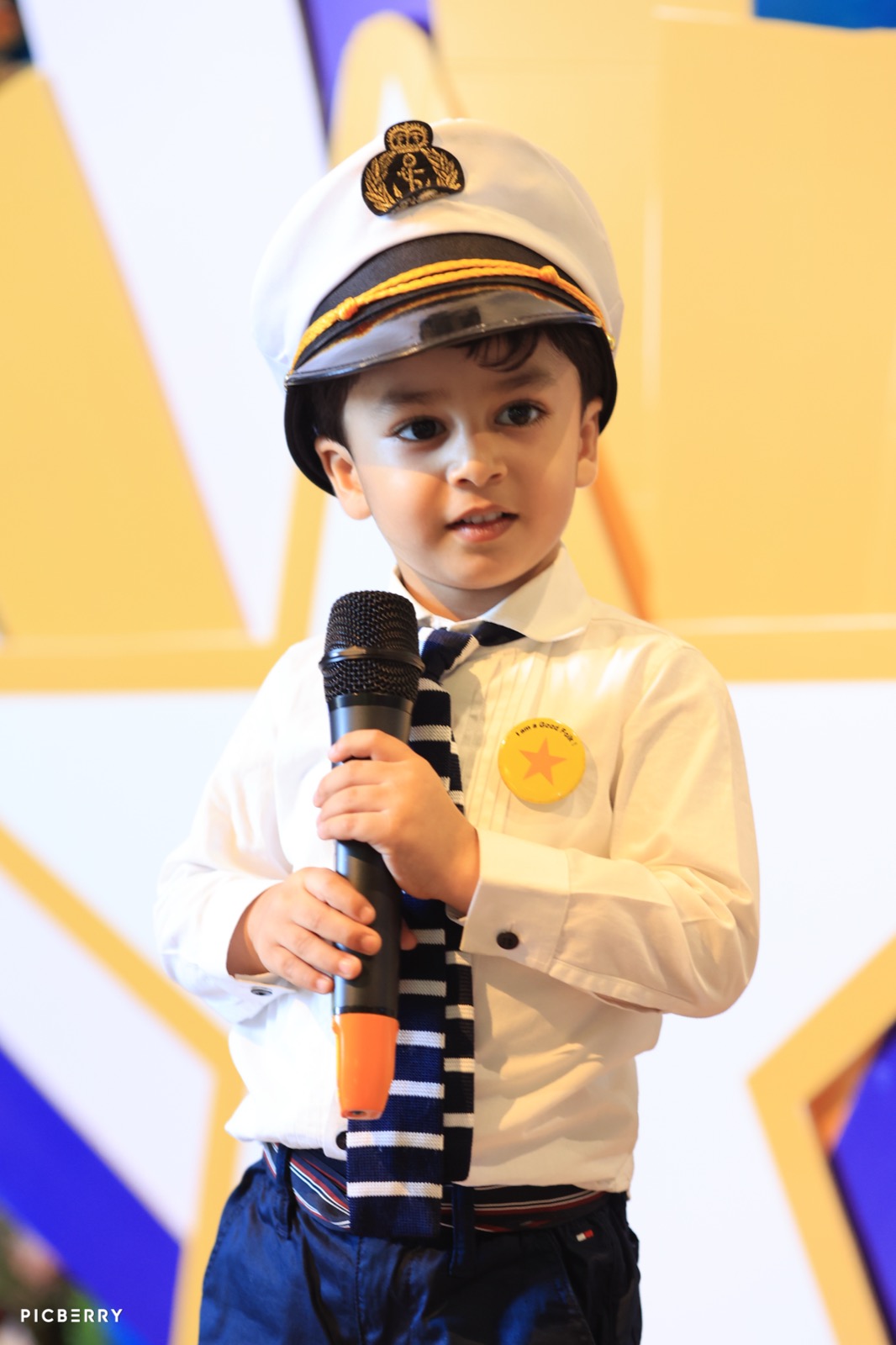Young student in a captain's hat speaking at Entrepreneurship Day
