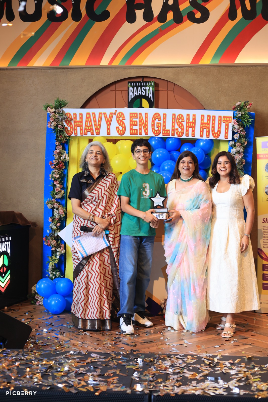 Student receiving a trophy at the Entrepreneurship Day awards