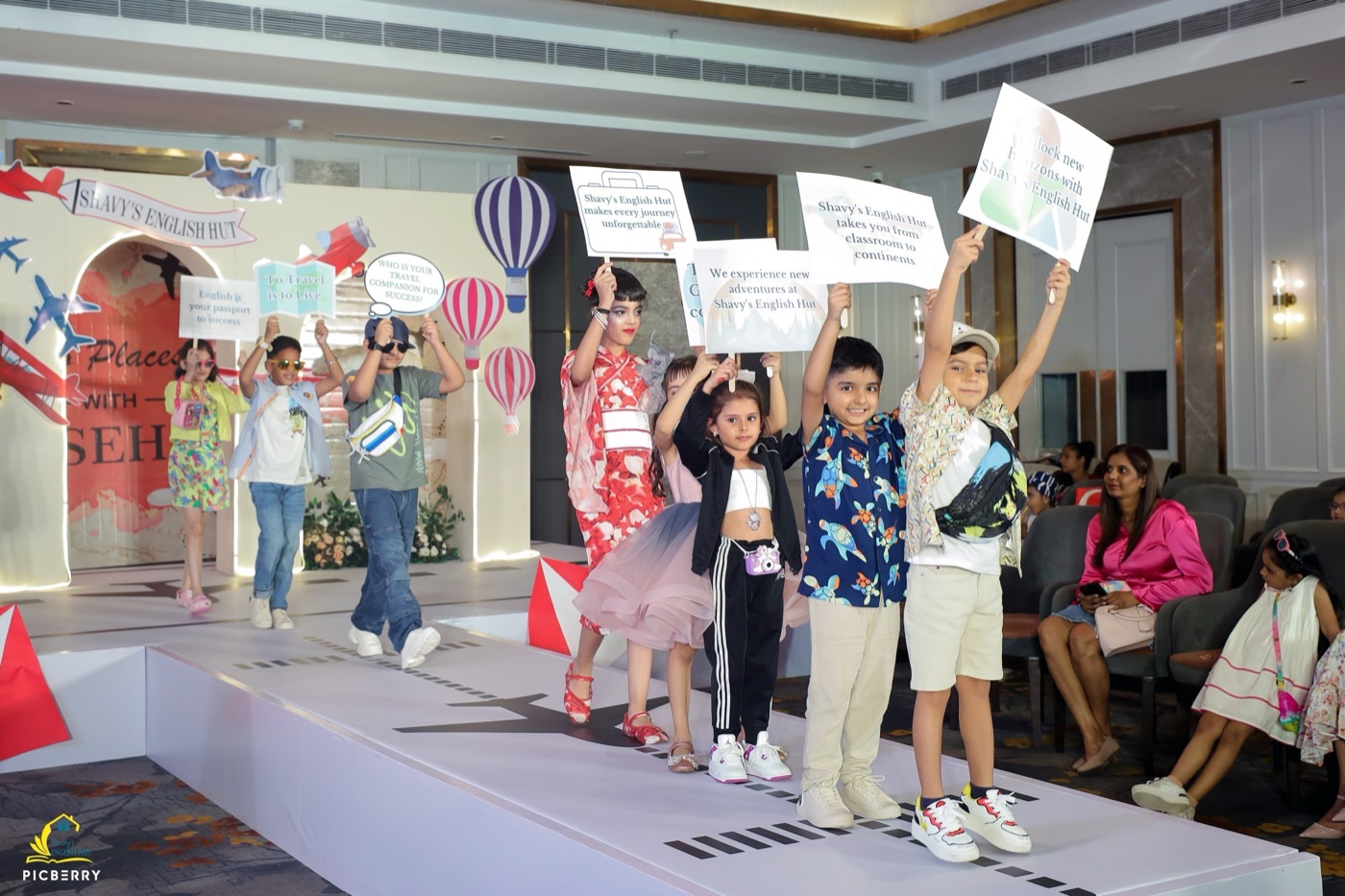 Students on stage at a Shavy's English Hut fashion show