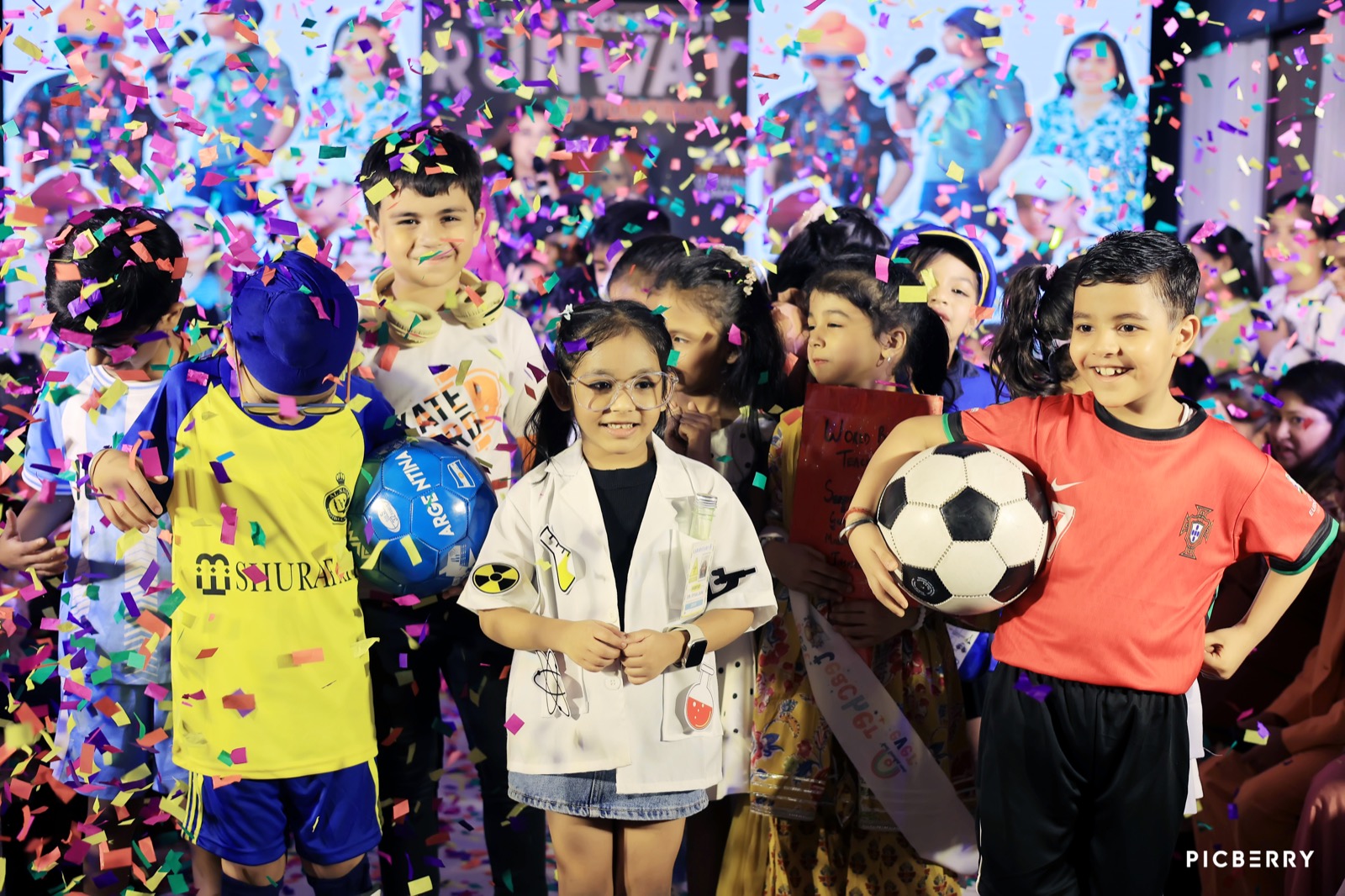 Group of students in career-themed costumes at the Runway to Tomorrow fashion show