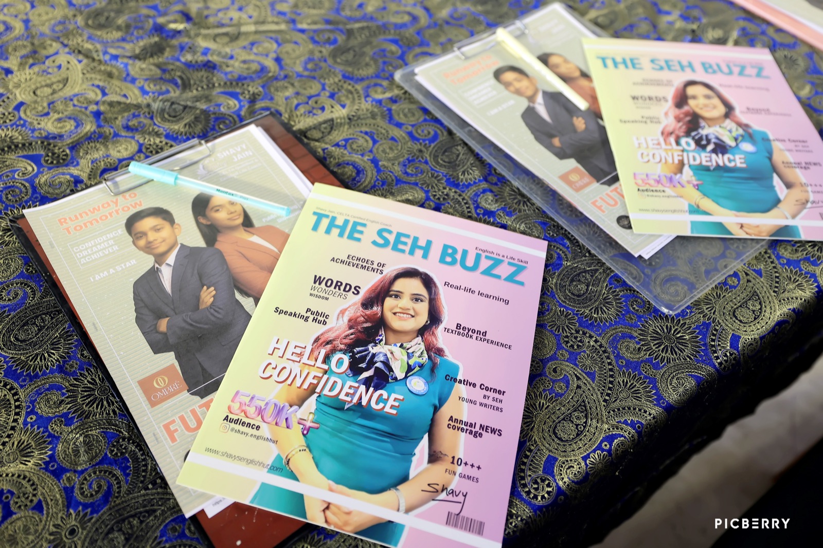 The SEH Buzz community magazine covers featuring Coach Shavy Jain